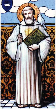 Stained‑glass artwork showing a robed figure holding a book